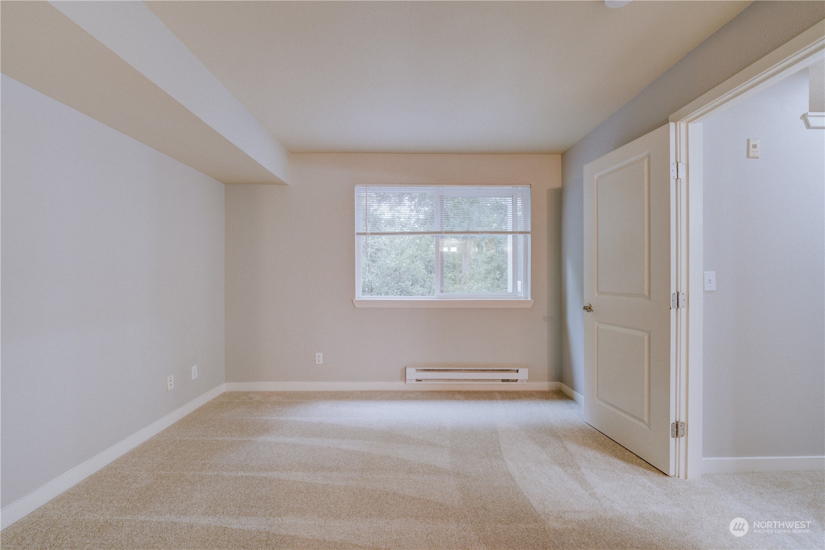 3908 243rd Place Southeast, Unit Q202 Bothell, WA 98021 - Photo 30 of 40 a view of an empty room with a window