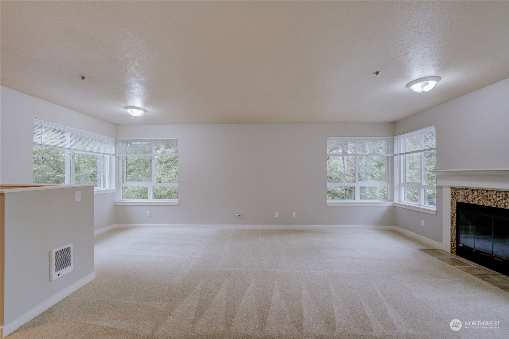 3908 243rd Place Southeast, Unit Q202 Bothell, WA 98021 - Photo 3 of 40 a view of empty room with front door