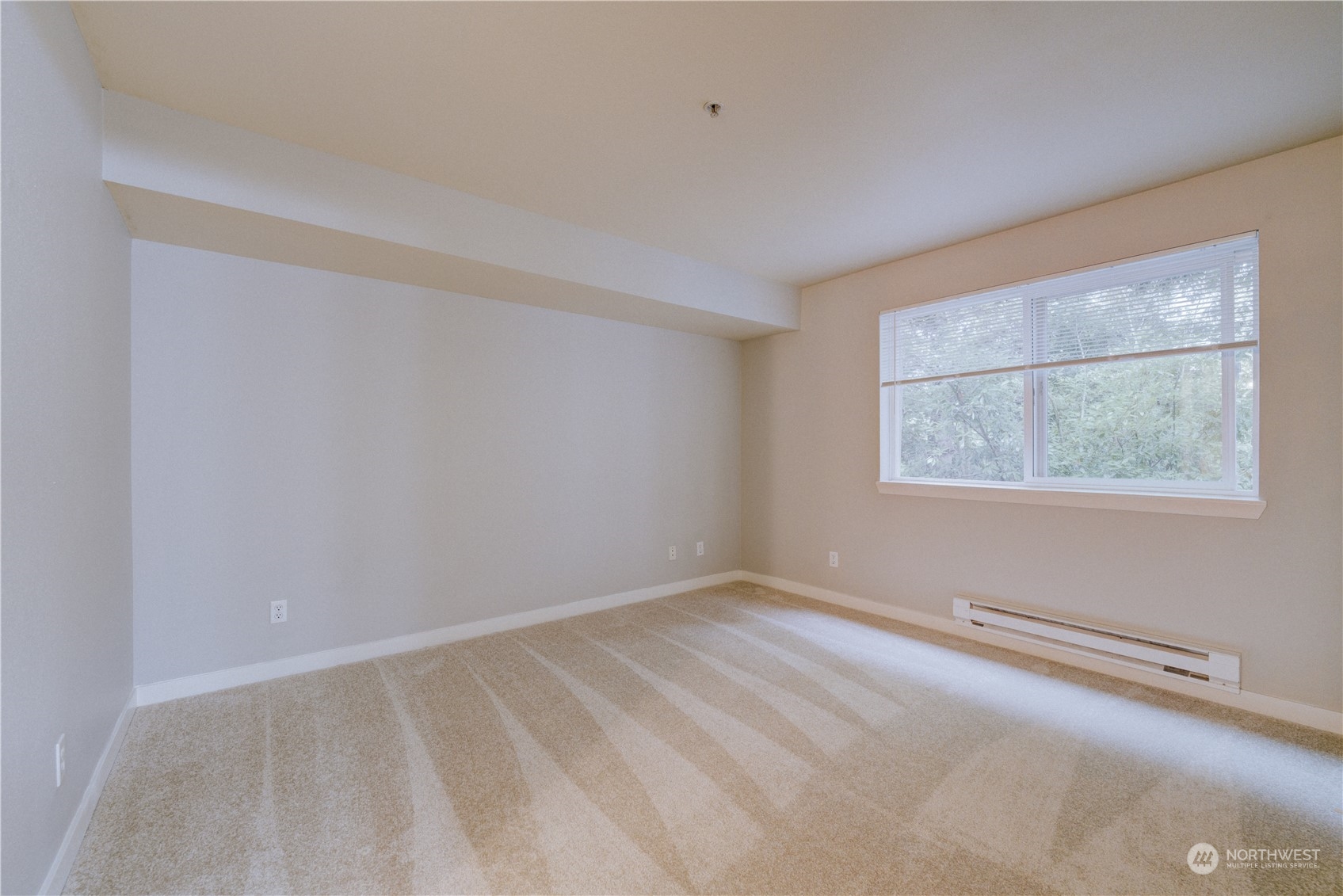 3908 243rd Place Southeast, Unit Q202 Bothell, WA 98021 - Photo 32 of 40 a view of an empty room with a window