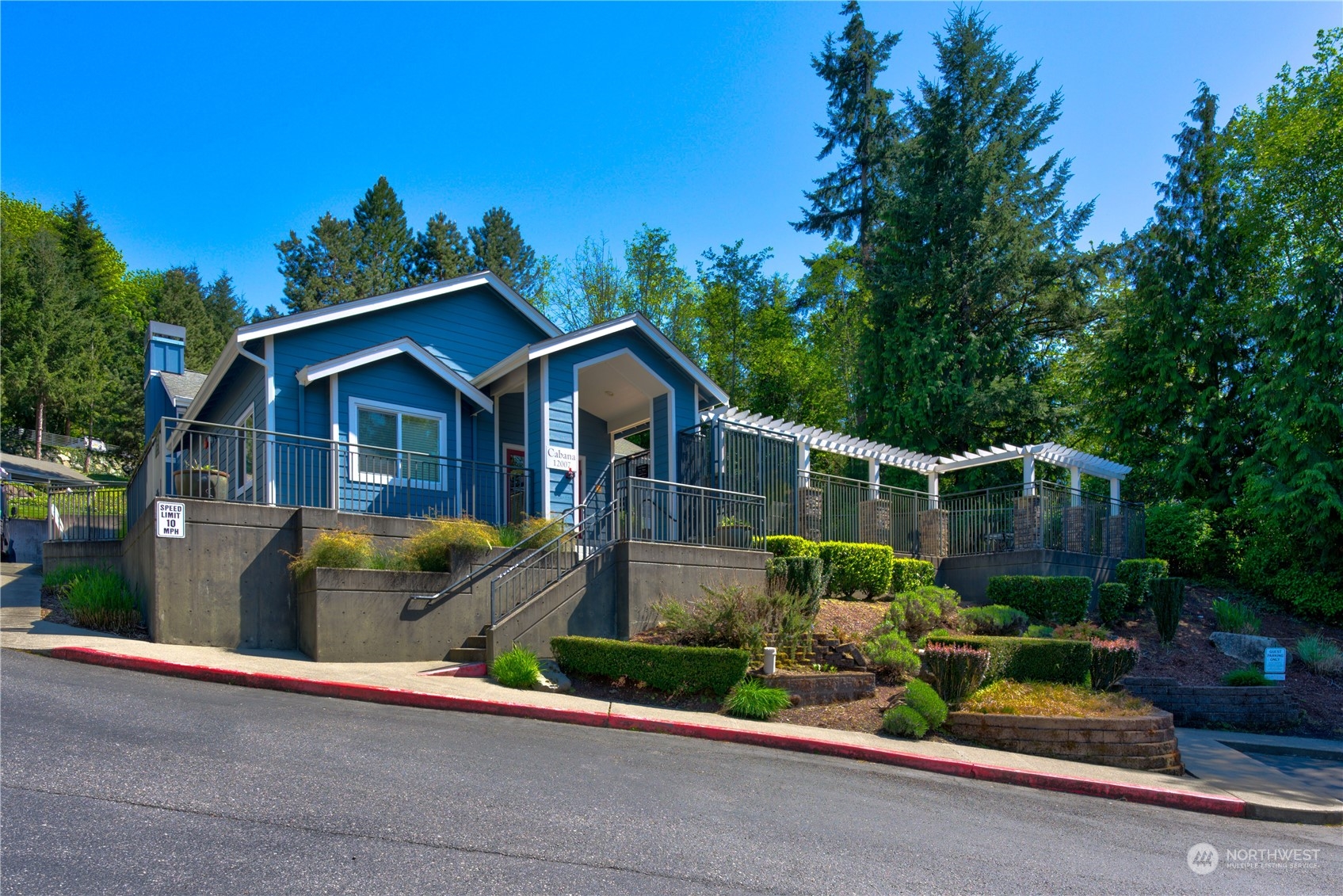 3908 243rd Place Southeast, Unit Q202 Bothell, WA 98021 - Photo 35 of 40 a front view of a house with a garden