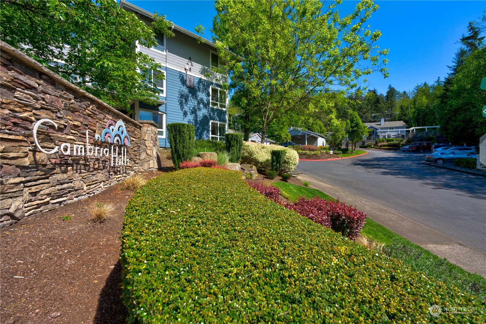 3908 243rd Place Southeast, Unit Q202 Bothell, WA 98021 - Photo 40 of 40 a view of a backyard with plants and a garden