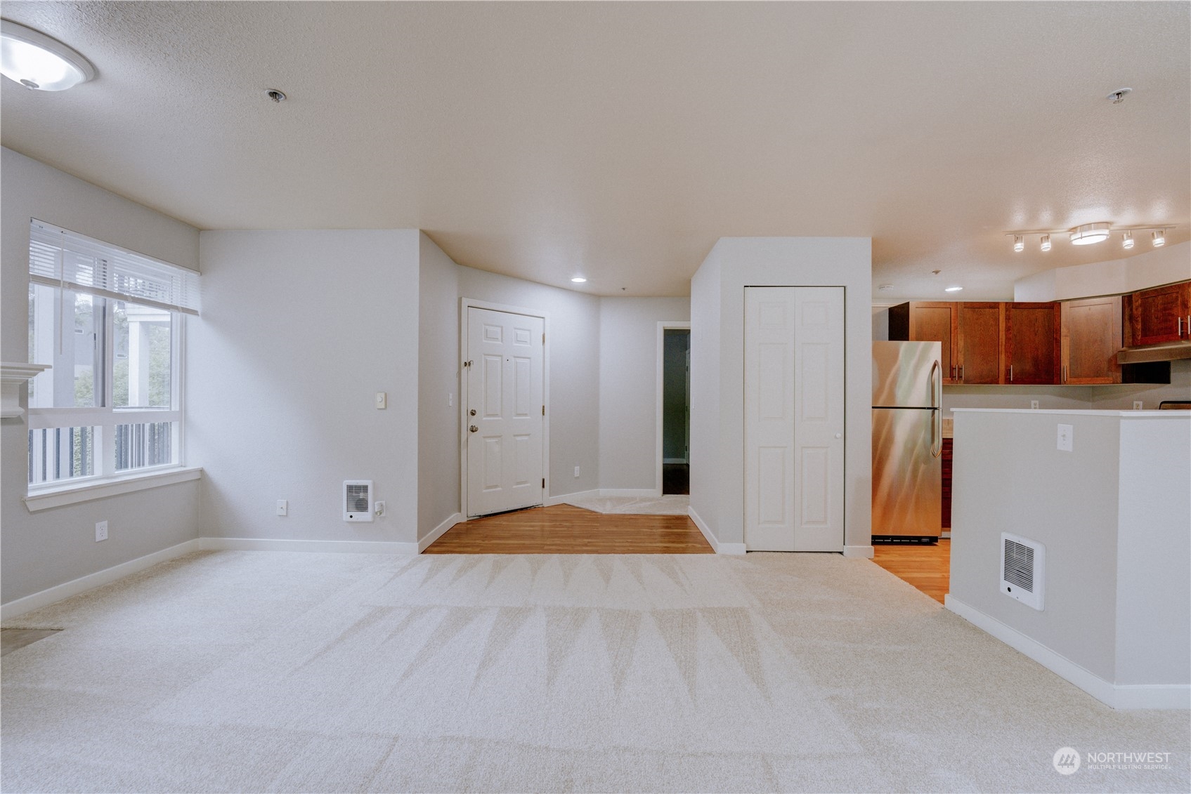 3908 243rd Place Southeast, Unit Q202 Bothell, WA 98021 - Photo 9 of 40 a view of livingroom with furniture and a kitchen
