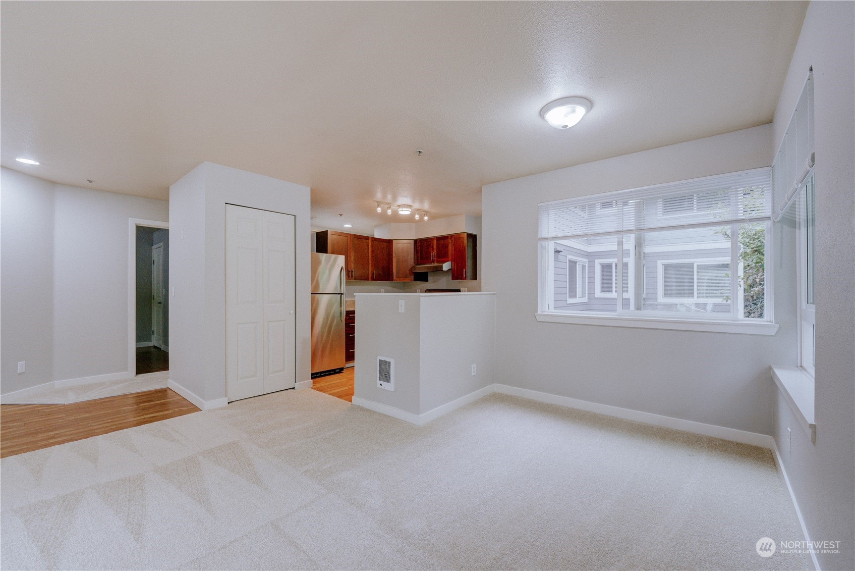 3908 243rd Place Southeast, Unit Q202 Bothell, WA 98021 - Photo 10 of 40 a view of a big room with windows and chandelier