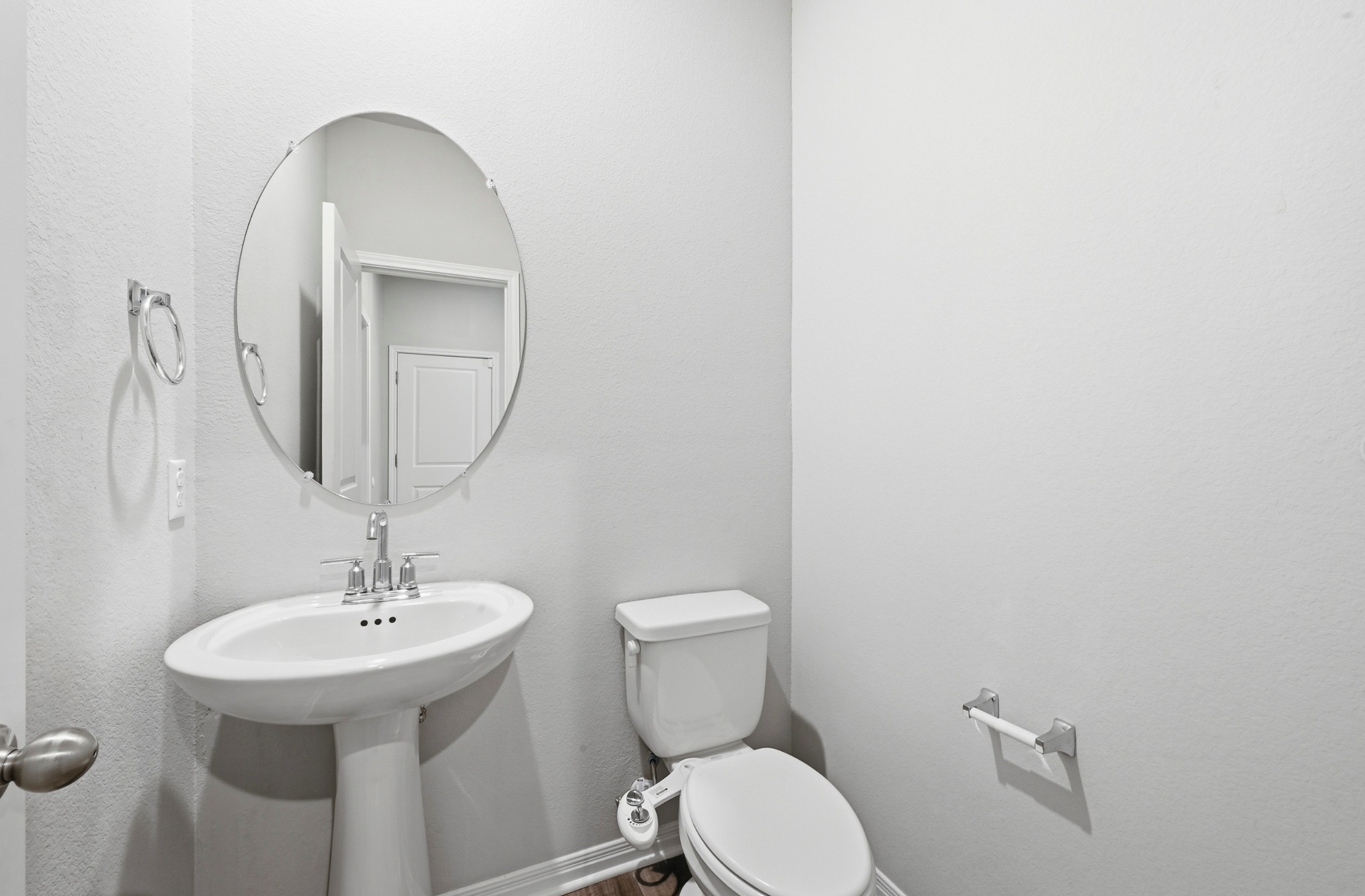 12606 Dairywork Road Buda, TX 78610 - Photo 20 of 32 a bathroom with a toilet sink and mirror