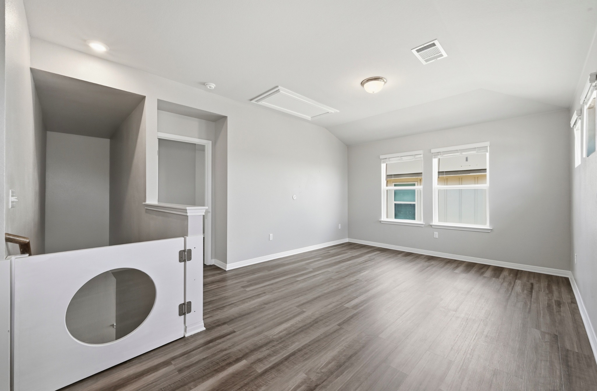 12606 Dairywork Road Buda, TX 78610 - Photo 21 of 32 wooden floor in an empty room with a window and wooden floor