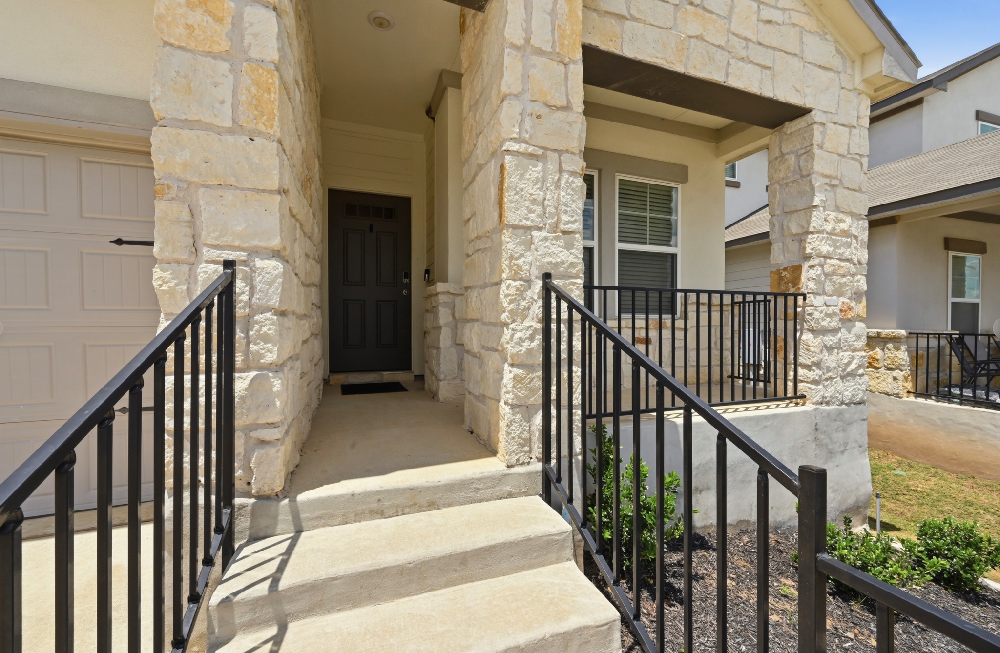 12606 Dairywork Road Buda, TX 78610 - Photo 3 of 32 a view of a balcony with wooden floor and stairs