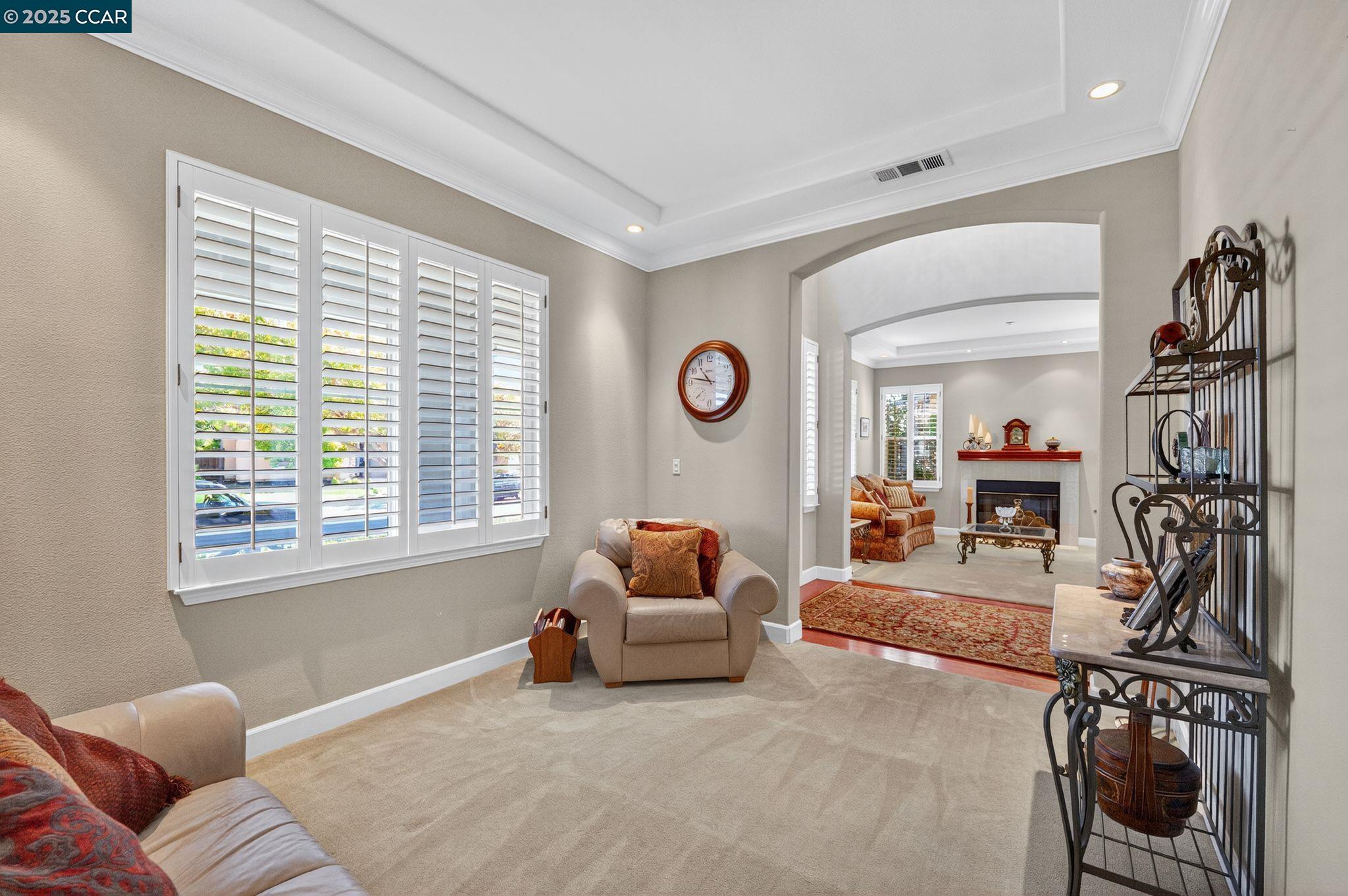 255 Prato Way Livermore, CA 94550 - Photo 11 of 45 a living room with furniture and a flat screen tv