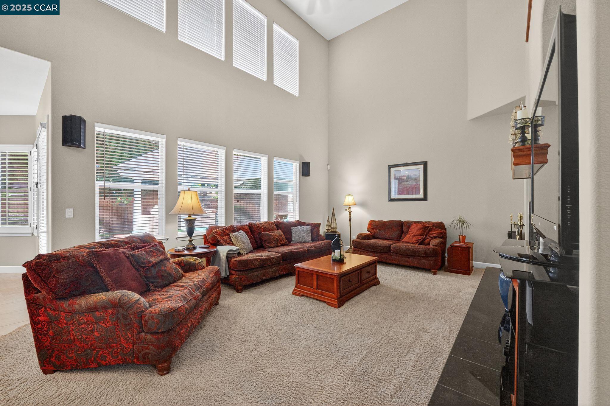 255 Prato Way Livermore, CA 94550 - Photo 13 of 45 a living room with furniture and a flat screen tv