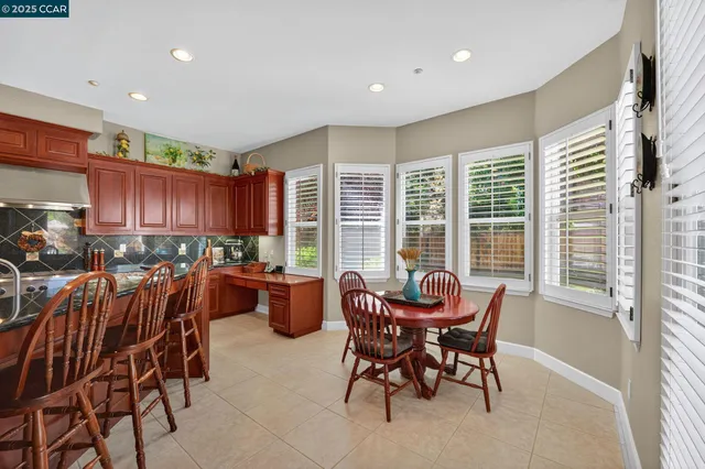 a view of a dining room with furniture window and outside view