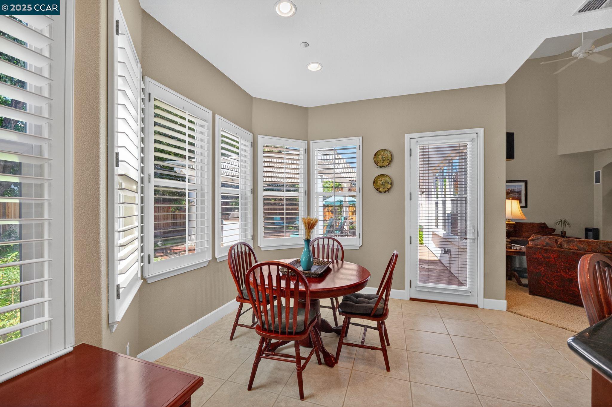 255 Prato Way Livermore, CA 94550 - Photo 23 of 45 a dining room with furniture and wooden floor