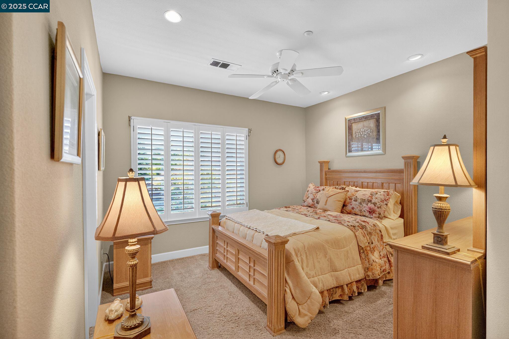 255 Prato Way Livermore, CA 94550 - Photo 24 of 45 a bedroom with a bed and wooden floor