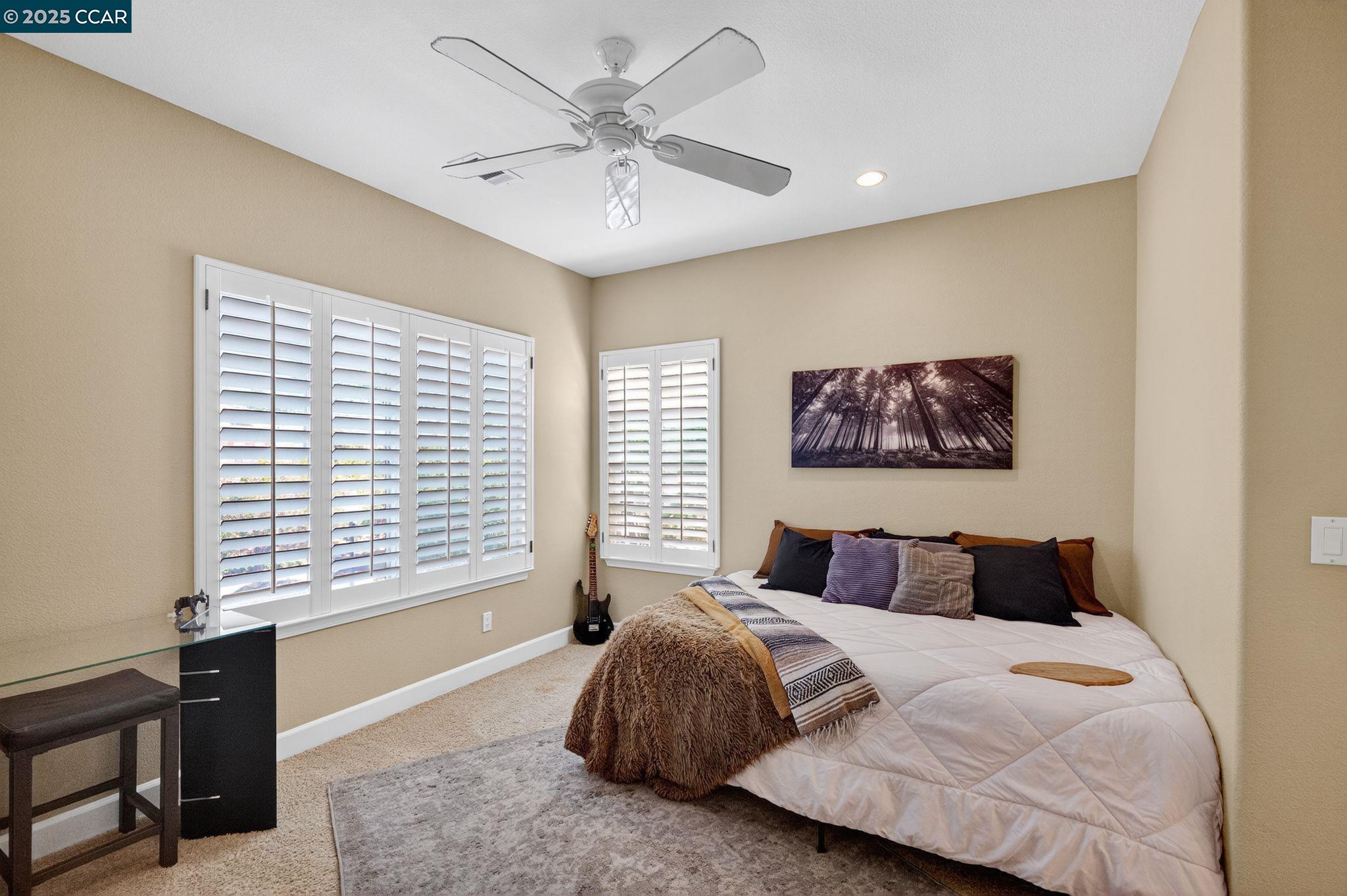 255 Prato Way Livermore, CA 94550 - Photo 27 of 45 a bedroom with a large bed and a window