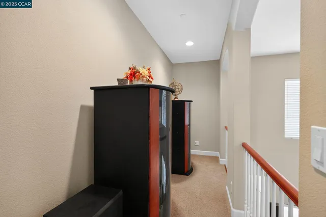 a view of a hallway to a room with a hallway