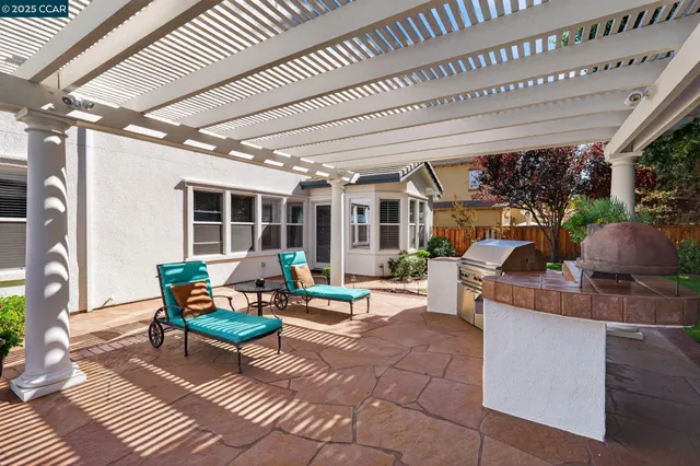 a outdoor living space with patio furniture and garden view