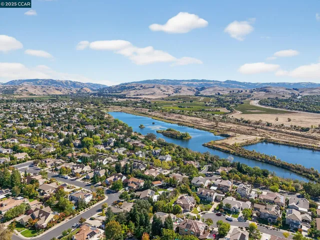 an aerial view of residential building and ocean view