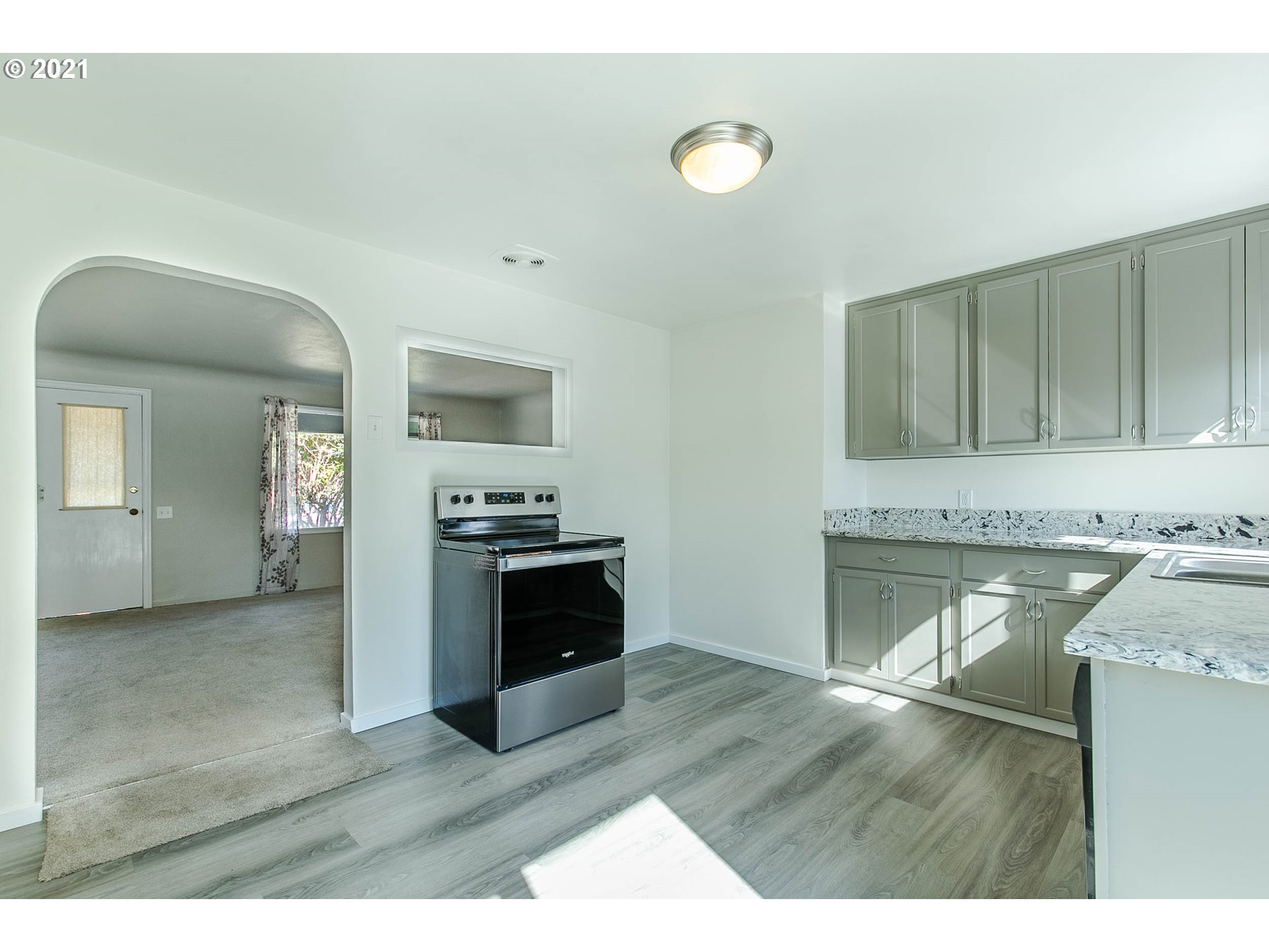 1469 Parker Street Springfield, OR 97477 - Photo 13 of 30 a kitchen with granite countertop a stove top oven and sink