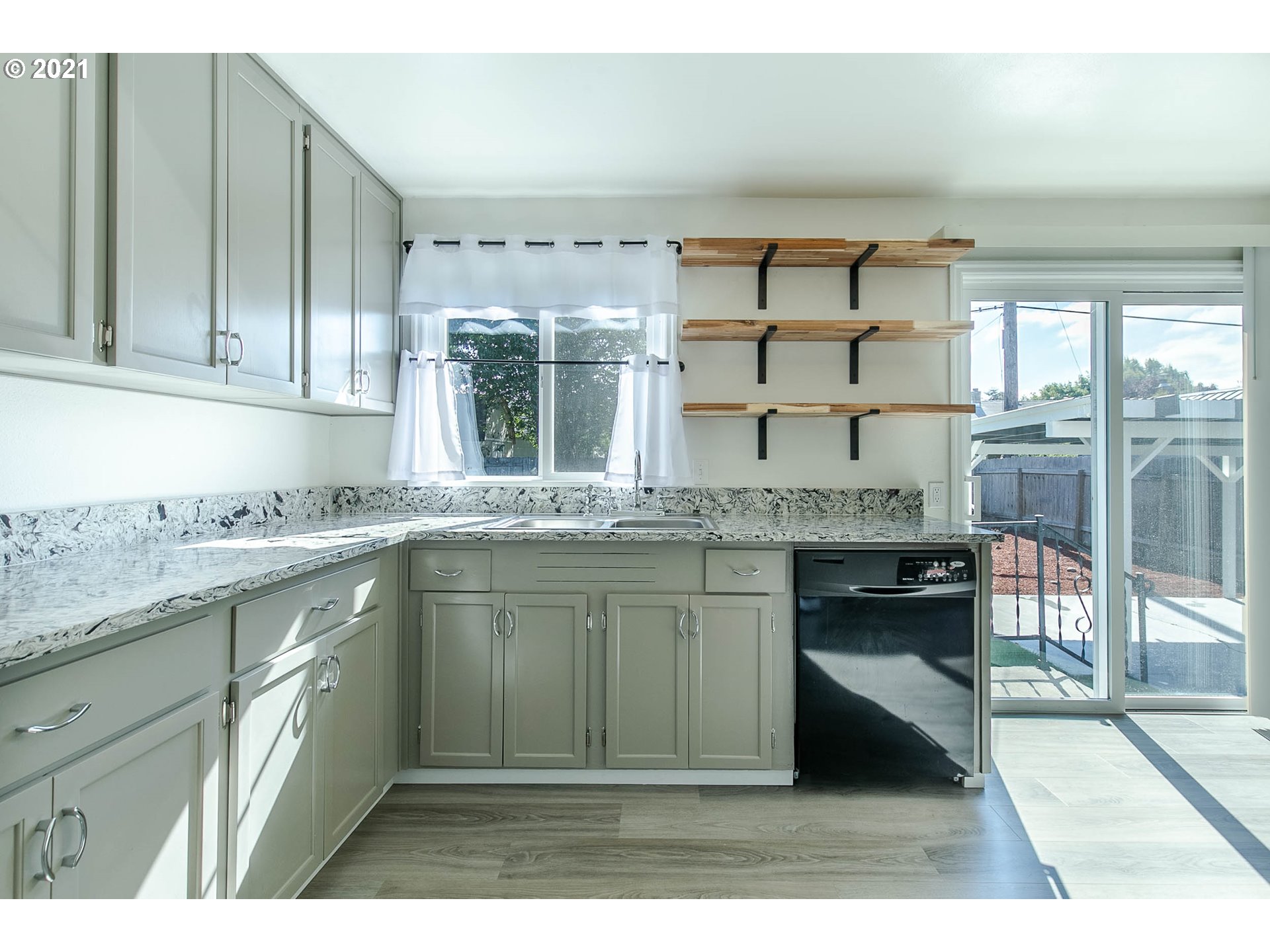 1469 Parker Street Springfield, OR 97477 - Photo 16 of 30 a kitchen with granite countertop a sink and a stove
