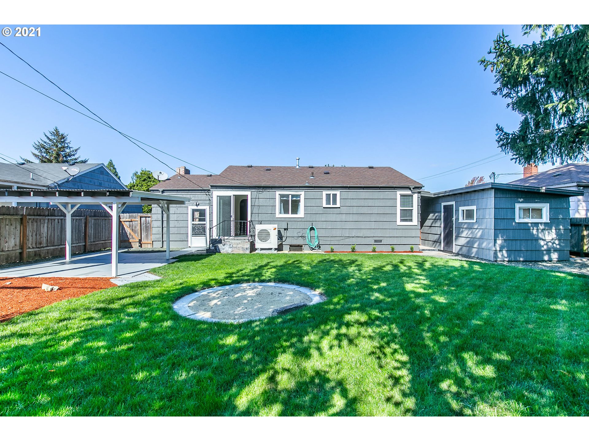 1469 Parker Street Springfield, OR 97477 - Photo 28 of 30 a front view of a house with a yard table and chairs