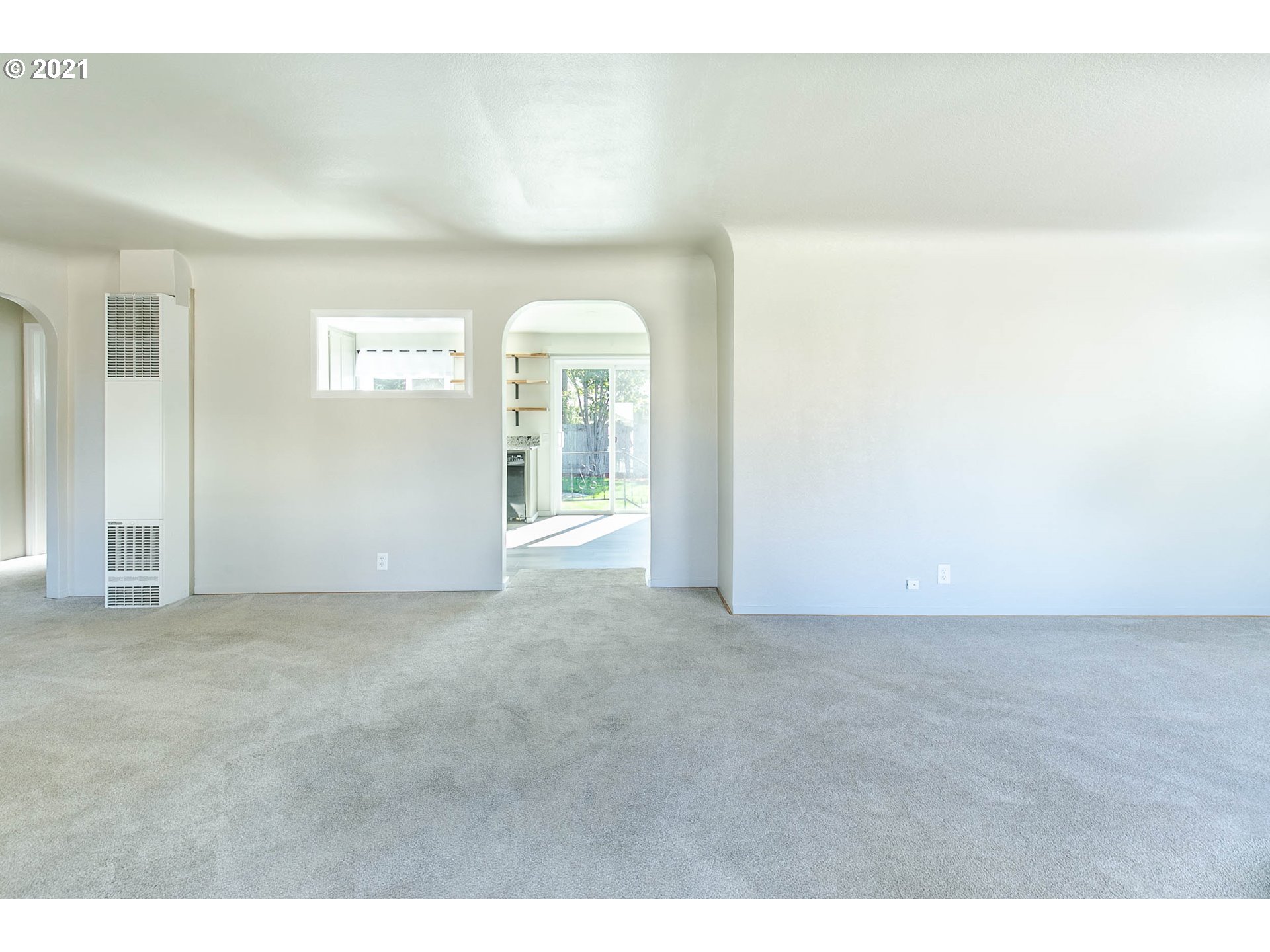 1469 Parker Street Springfield, OR 97477 - Photo 4 of 30 a view of an empty room with a window