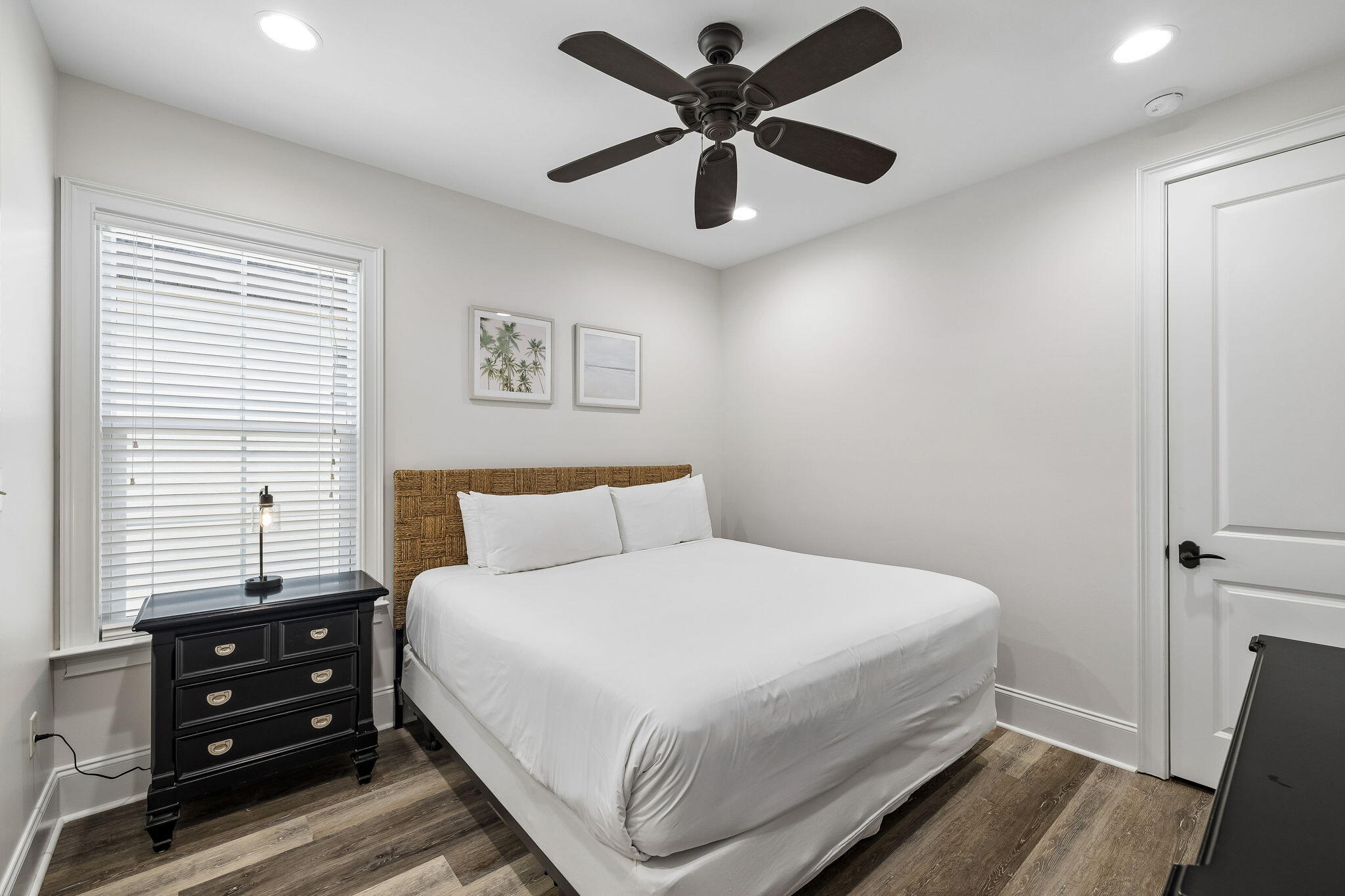 1973 Baytowne Loop Miramar Beach, FL 32550 - Photo 20 of 38 a bedroom with a bed and a chandelier