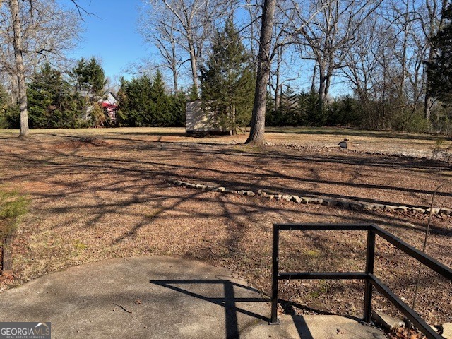 2395 High Falls Road Griffin, GA 30223 - Photo 20 of 20 a view of a backyard with trees