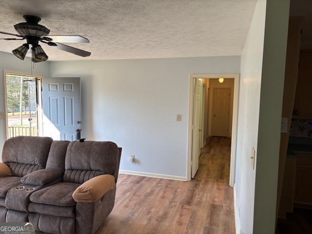 2395 High Falls Road Griffin, GA 30223 - Photo 3 of 20 a living room with furniture and a ceiling fan