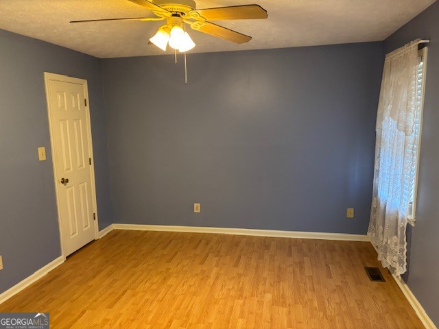 2395 High Falls Road Griffin, GA 30223 - Photo 7 of 20 wooden floor in an empty room