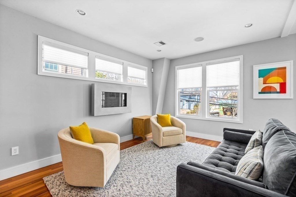 80 Summit Avenue, Unit 80 Brookline, MA 02446 - Photo 14 of 41 a living room with furniture and a large window