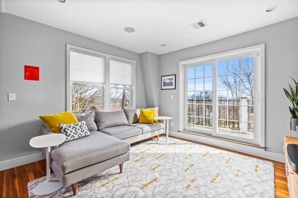 80 Summit Avenue, Unit 80 Brookline, MA 02446 - Photo 16 of 41 a living room with furniture and a window