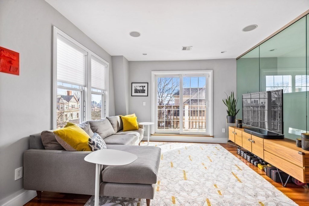 80 Summit Avenue, Unit 80 Brookline, MA 02446 - Photo 17 of 41 a living room with furniture and a flat screen tv