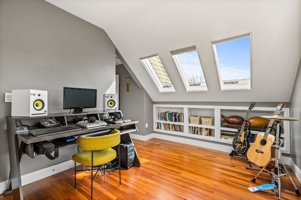 80 Summit Avenue, Unit 80 Brookline, MA 02446 - Photo 24 of 41 a view of a workspace with furniture and wooden floor