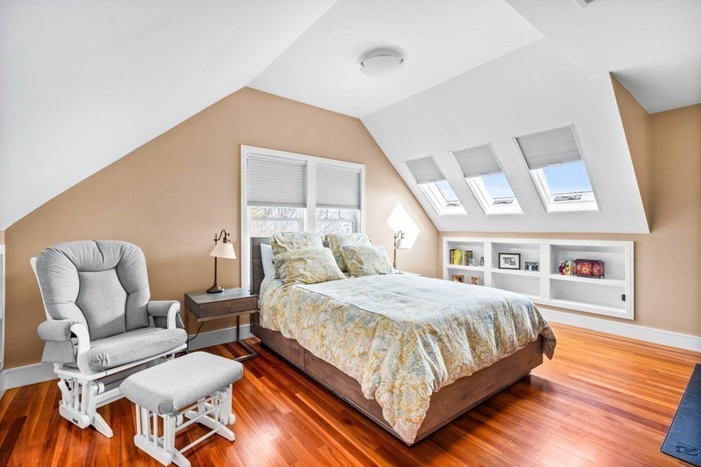80 Summit Avenue, Unit 80 Brookline, MA 02446 - Photo 29 of 41 a bedroom with a bed and wooden floor