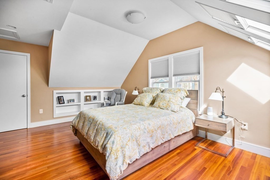 80 Summit Avenue, Unit 80 Brookline, MA 02446 - Photo 30 of 41 a bedroom with a bed and a table