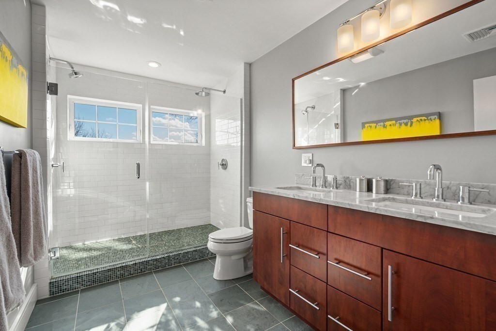 80 Summit Avenue, Unit 80 Brookline, MA 02446 - Photo 32 of 41 a spacious bathroom with a granite countertop sink toilet and shower