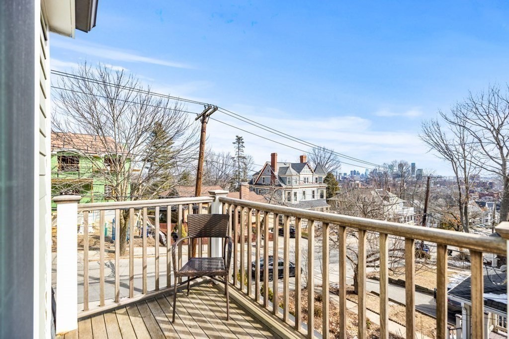 80 Summit Avenue, Unit 80 Brookline, MA 02446 - Photo 34 of 41 a view of a balcony with wooden floor