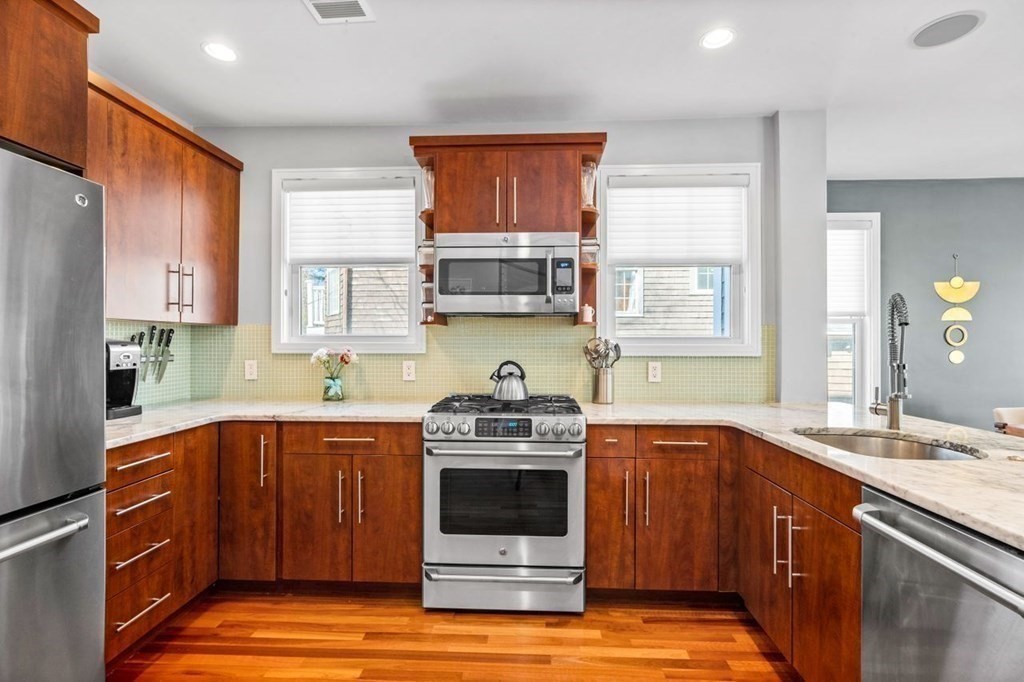 80 Summit Avenue, Unit 80 Brookline, MA 02446 - Photo 7 of 41 a kitchen with a sink stove top oven and refrigerator