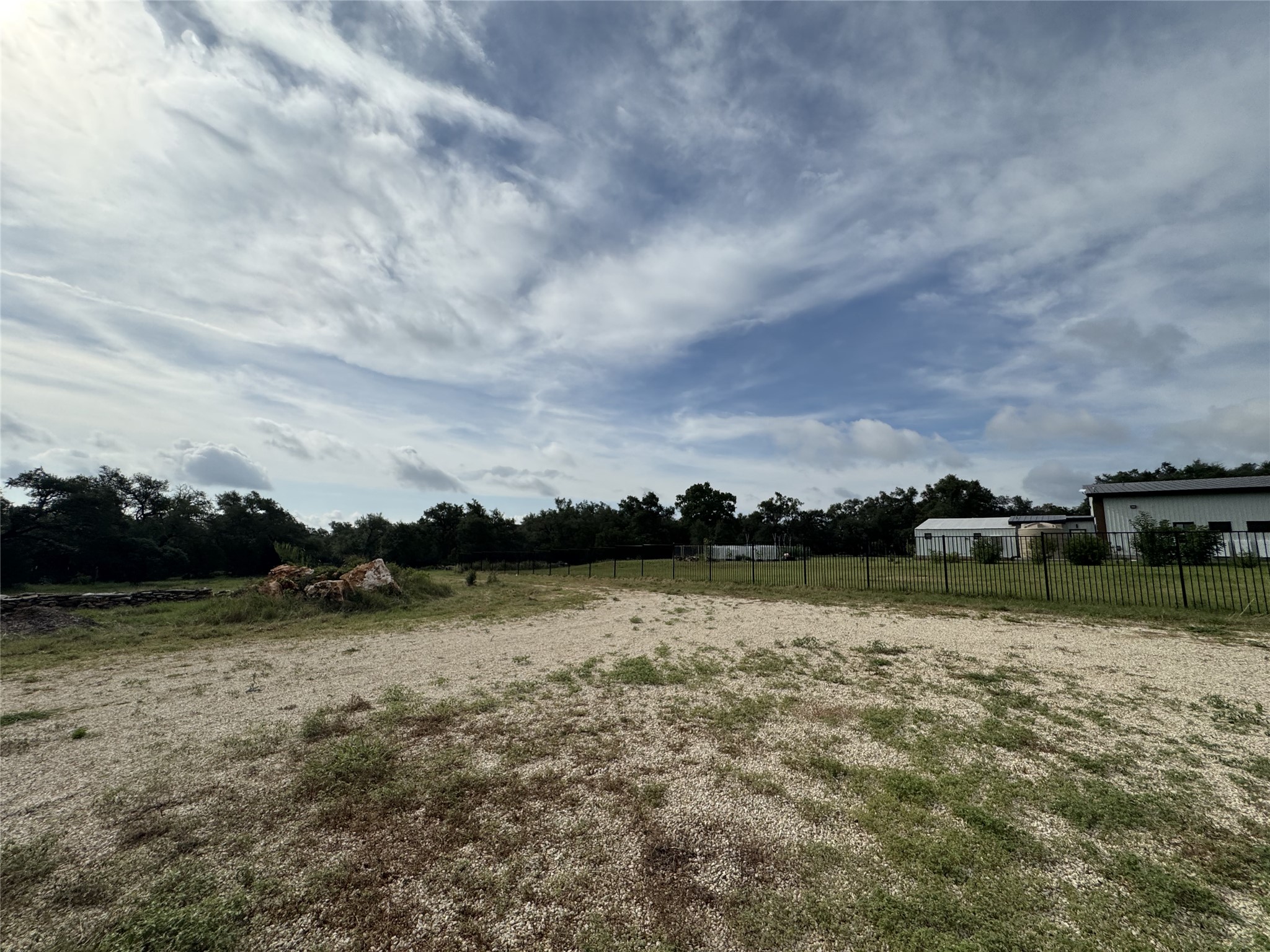109 Estancia Way Georgetown, TX 78628 - Photo 20 of 22 a view of a lake with houses in the back