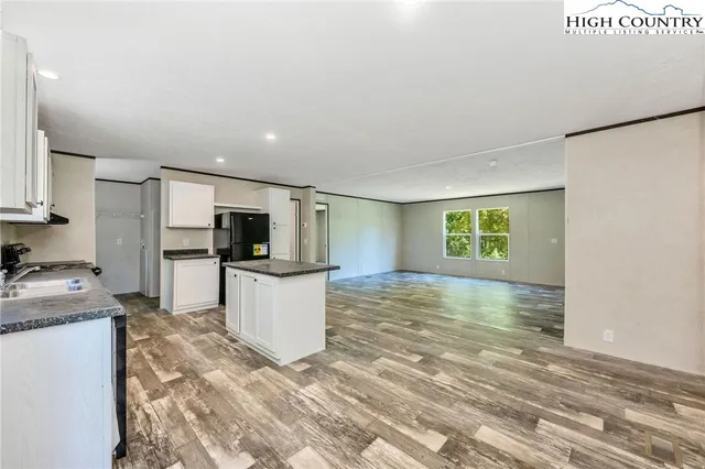 a view of living room with furniture and flat screen tv