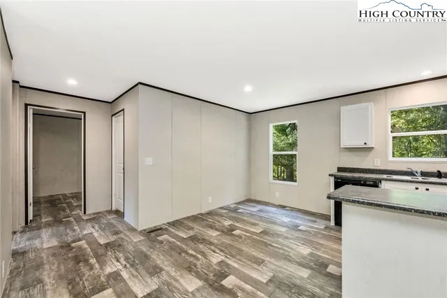 a view of a kitchen with a sink and cabinets