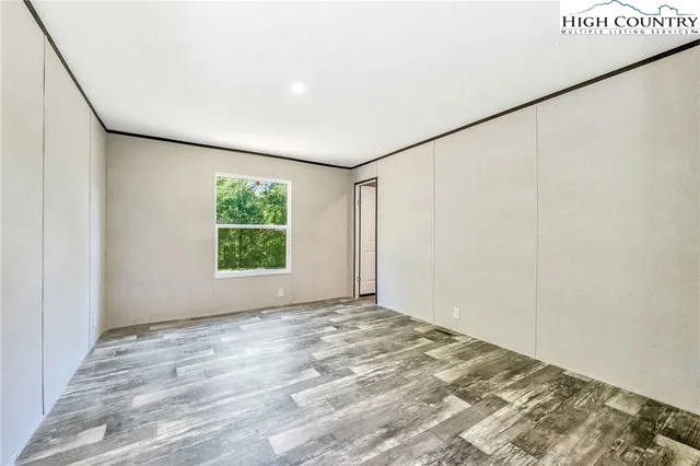 a view of room with window and ceiling fan