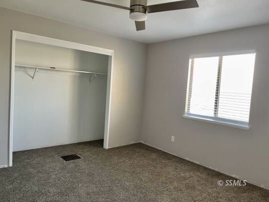 104 South Lilac Street Ridgecrest, CA 93555 - Photo 7 of 7 a view of an empty room with a window