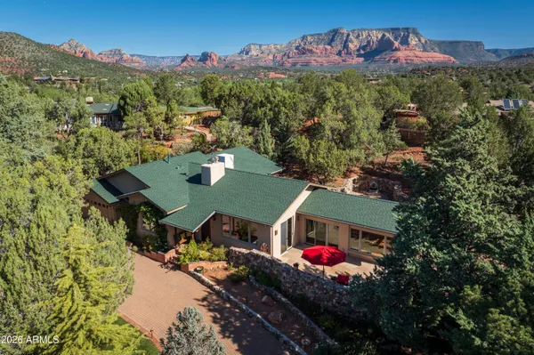 an aerial view of a house with yard