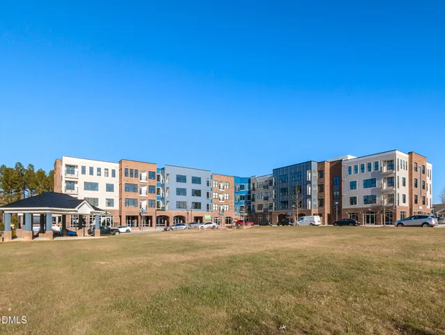 a view of a brick building with many windows