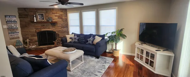 a living room with furniture and a flat screen tv