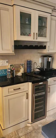 a kitchen with stainless steel appliances granite countertop a stove and a microwave