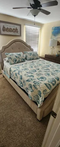 a bedroom with a bed and a dresser