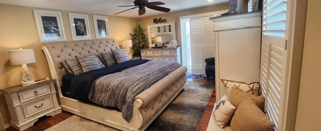 a bed room with a bed and a chandelier