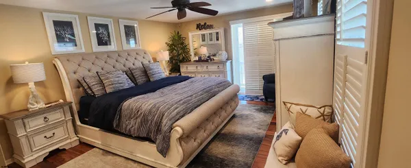 a bed room with a bed and a chandelier