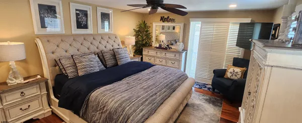 a bedroom with a bed and a couch
