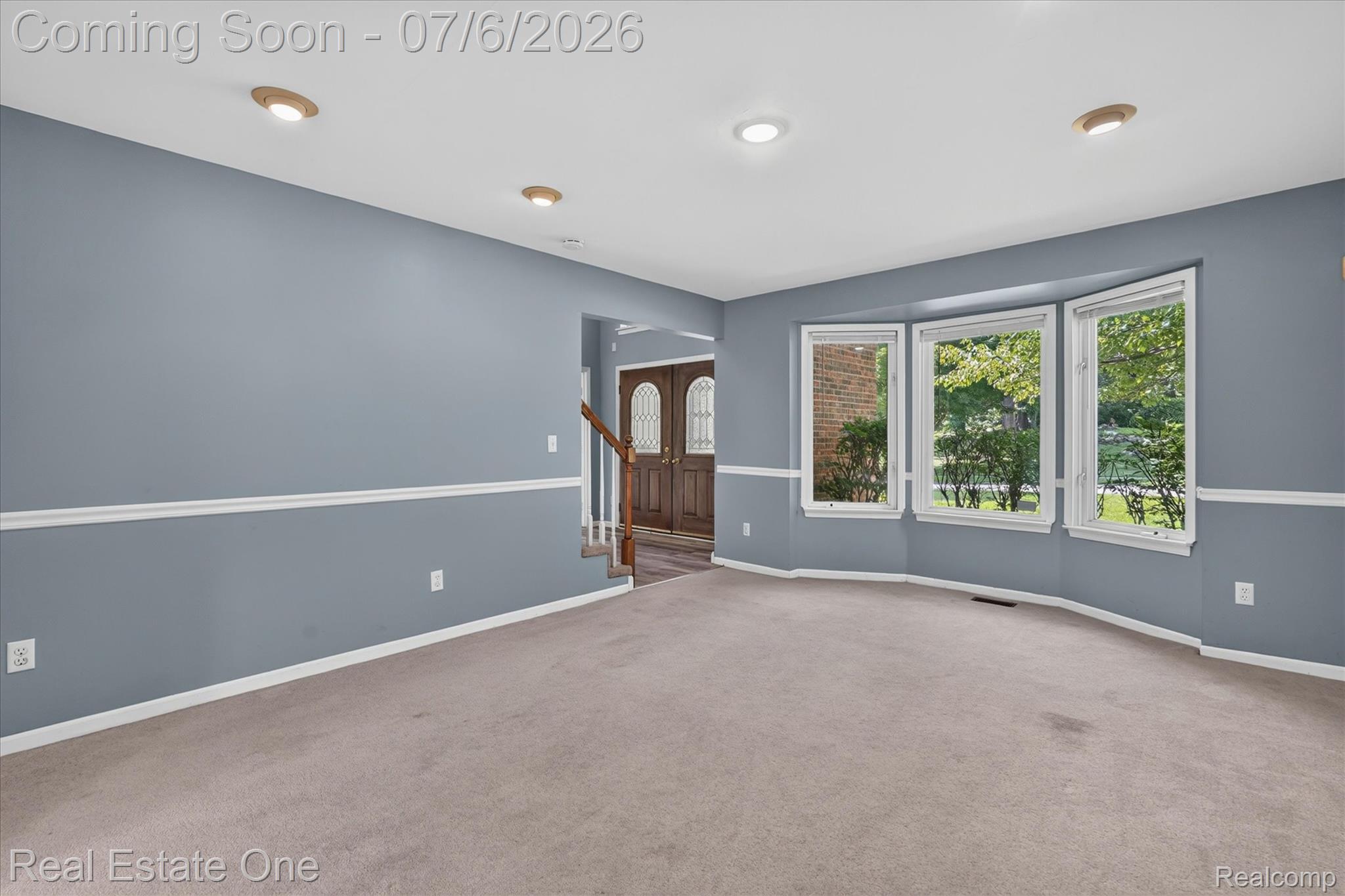 9610 Forest Ridge Drive Clarkston, MI 48348 - Photo 10 of 77 Anchored by a gorgeous bay window that floods the room with natural light, the massive family room is both elegant and inviting. Neutral tones, generous proportions, and an open, airy atmosphere make this the ideal space for entertaining, cozy evenings at home, or enjoying picturesque views year-round.